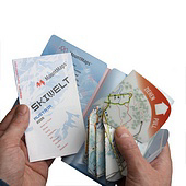 Waterproof three-dimensional skiing map being held.